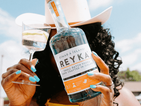 woman holding drink - tennessee spirits