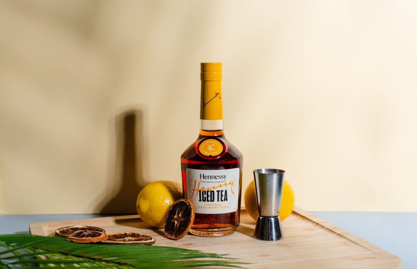 Hennessy Iced Tea Inspired Cognac Cocktail Bottle with lemons around it